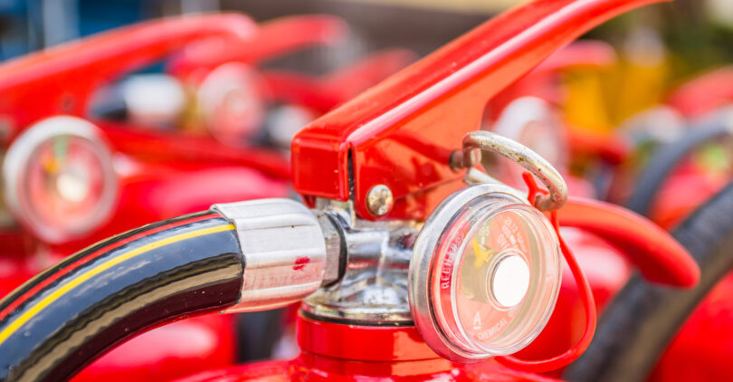 Red fire extinguishers available in fire emergencies.
[[** Note: Shallow depth of field
** Note: Visible grain at 100%, best at smaller sizes