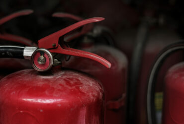 Closeup of red fire extinguishers Closeup of red fire extinguishers